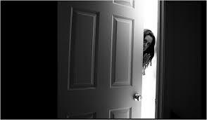 Girl closing door